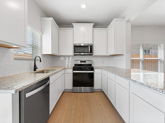 The kitchen has energy-efficient appliances.