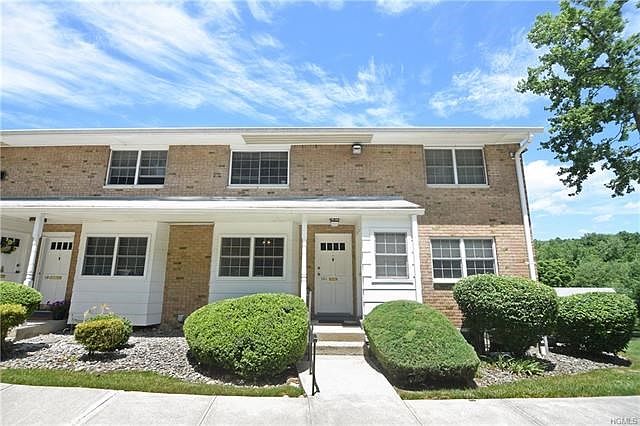 Lovingly maintained first floor unit at sought after Stonegage.  Corner Unit!