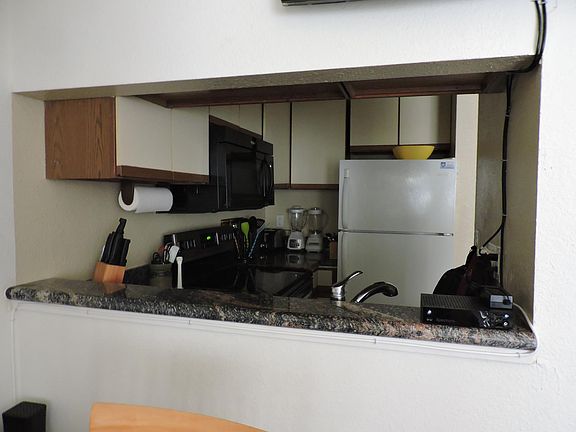 Renovated kitchen with granite counters, new floor and new dishwasher.