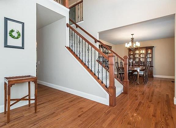 Another view of the stair system and the Dining Room beyond.  You can also see a glimpse of the rail on the upper level overlooking the 2 Story Foyer.
