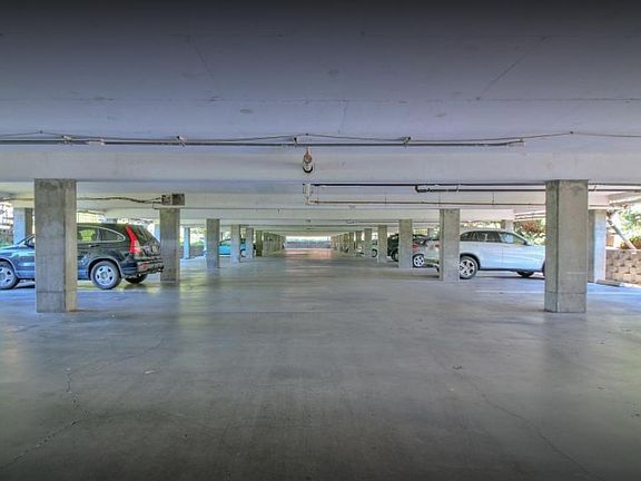 garage in the basement with an assigned spot