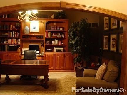 Den w/ Natural Cherry Built-Ins : Equipped for a humidor above the desk.