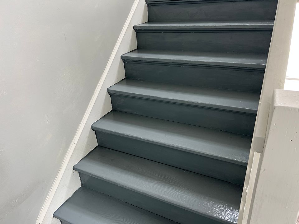 staircase to back side of apt building/ parking lot