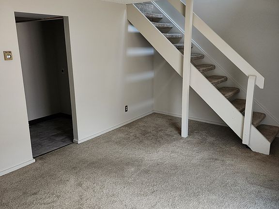 Dining room or living room with coat/shoe closet.