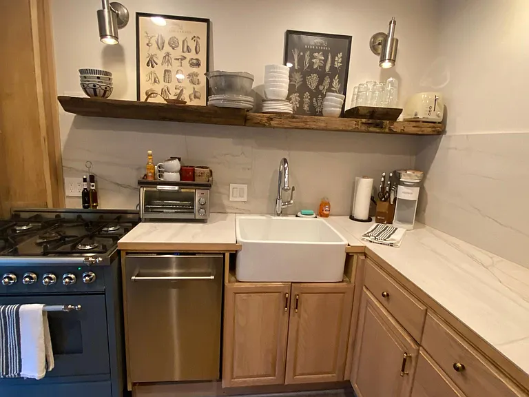 Renovated kitchen with retro refrigerator, 19" dishwasher, mircowave, toaster and italian ILVE gas range.
