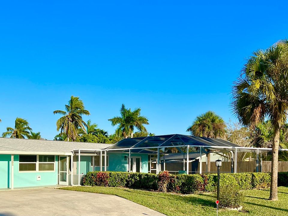Mid century home features lanai and pool