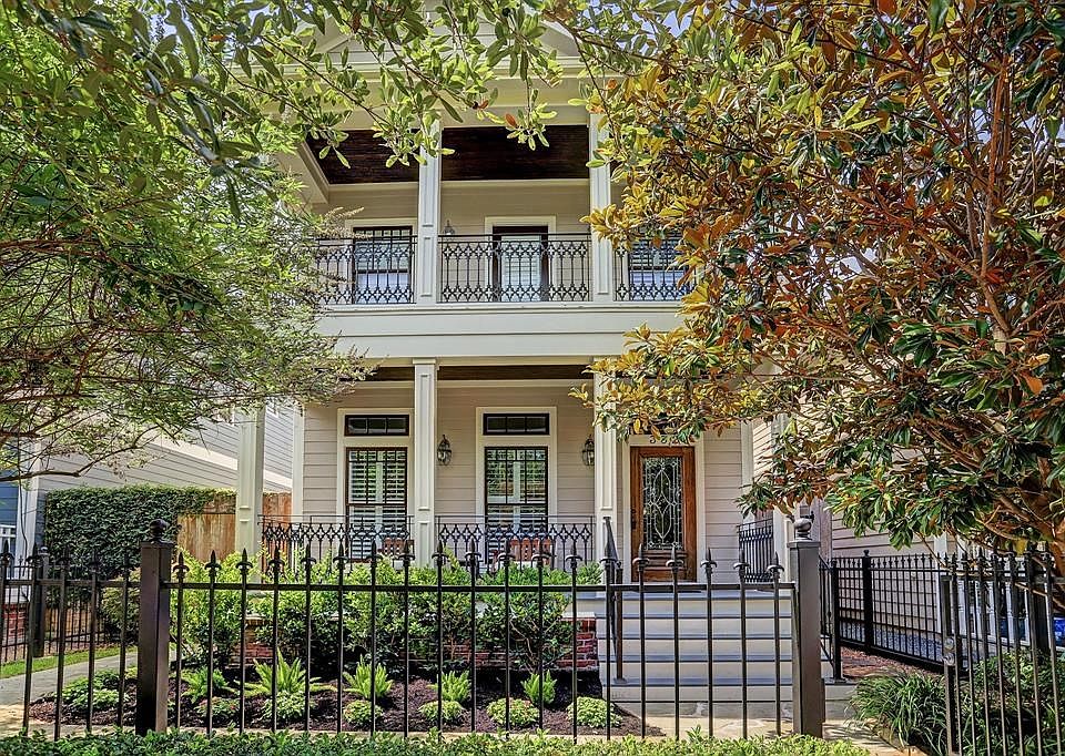 Gorgeous New Orleans style two story home with double gallery porches in the heart of Houston Heights.
