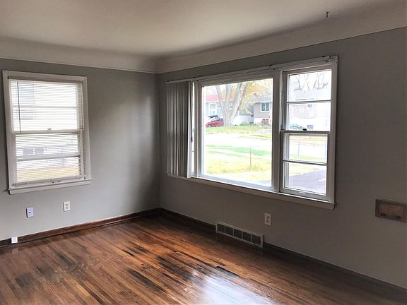 Living room with picture window and lots of light.