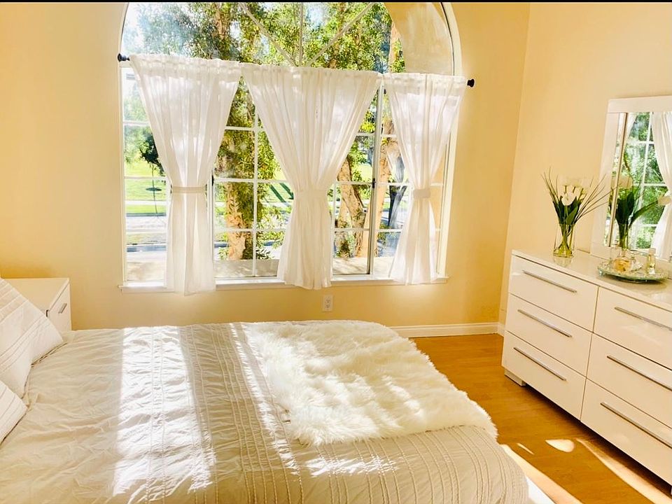 Second bedroom with access to the second bathroom, large window with view of the park