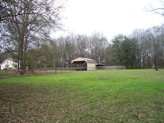 barn house and 1 of 3 pastures
