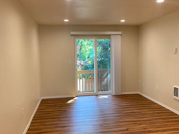 Living room and patio door to deck balcony