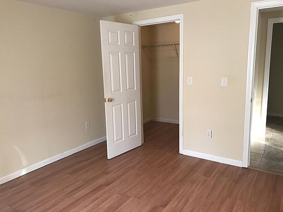 Bedroom with closet door open