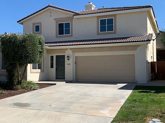 Front of house which is on a large corner lot for added privacy. Garage is a three car tandem.