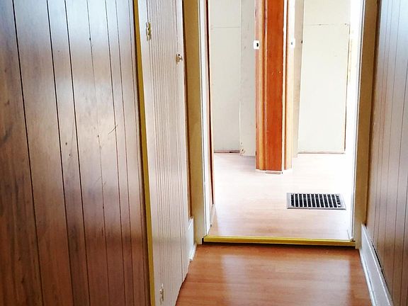 Upstairs small hallway leading towards second and third bedroom.