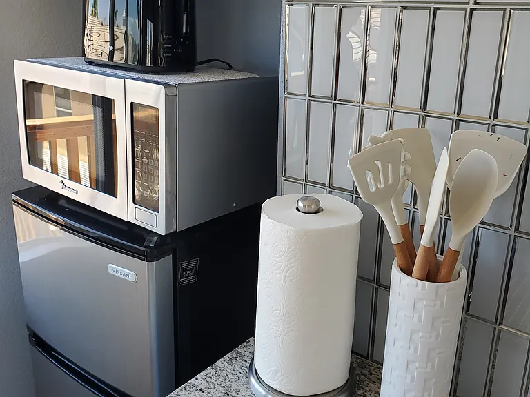 Refrigerator/freezer with Microwave and toaster.