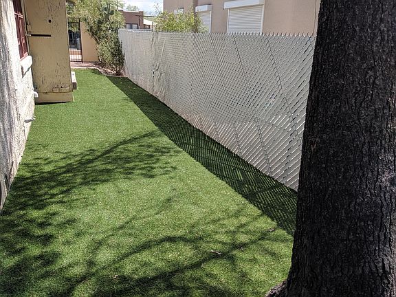 We put in enough astro grass to host a soccer event...don't worry it never needs water and is green all year round.