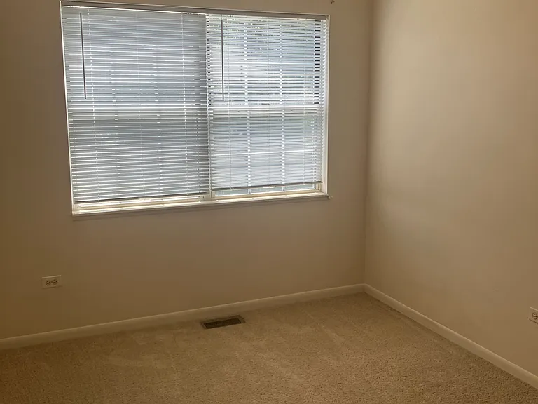 2nd bedroom has ceiling fan with lights