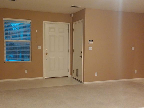 Living Room. Front Entry Door and Garage Interior Entry Door