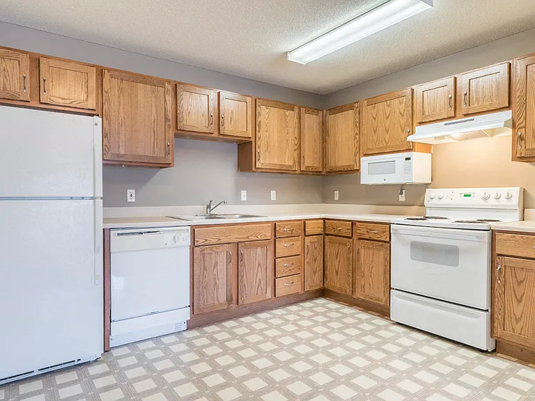 Generous cabinet storage and practical layouts make meal prep and daily routines feel more organized and effortless.