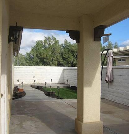 patio area with artificial grass