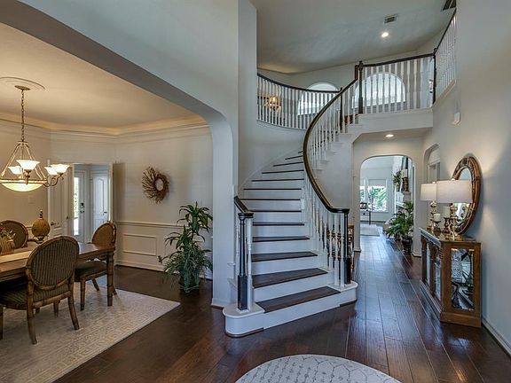 From the moment you enter, you are going to notice gorgeous staircase with wood banister which is an elegant focal point for the foyer, hardwoods and fresh soft white paint finish out the space.