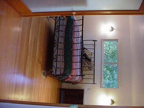 View the fireplace from this charming bedroom