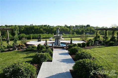 This exquisite outdoor living area is complete with a 12' statue with fountain as well as an outdoor fireplace with hidden propane lines ran.  You won't believe all this outdoor area has to offer!