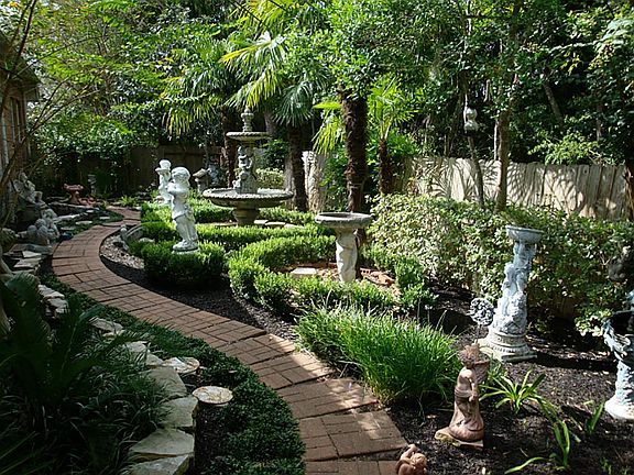 Beautiful back yard with lots of statuary.  Note some of these items are excluded from the sale, contact your agent for details.