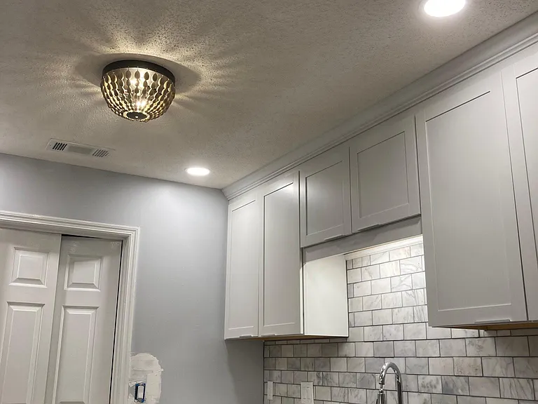 Quartz countertops and marble backsplash
