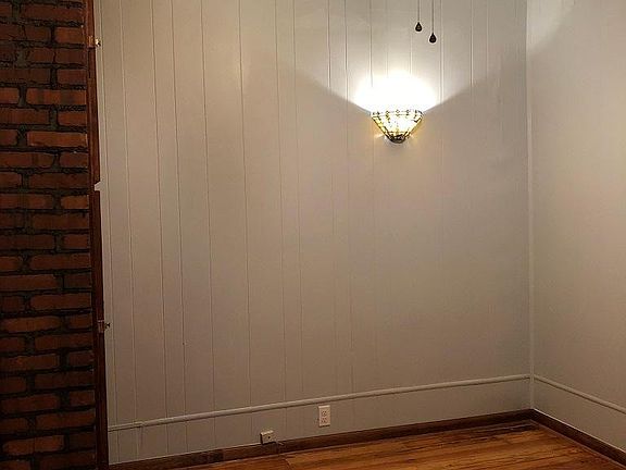 Master Bedroom with exposed old brick chimney