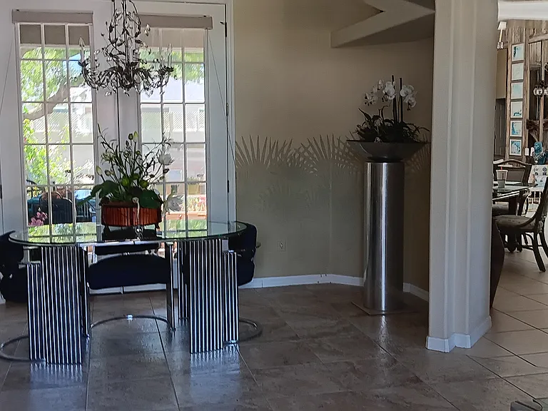 Entrance Foyer/Reception with veiw of Lanai and back yard