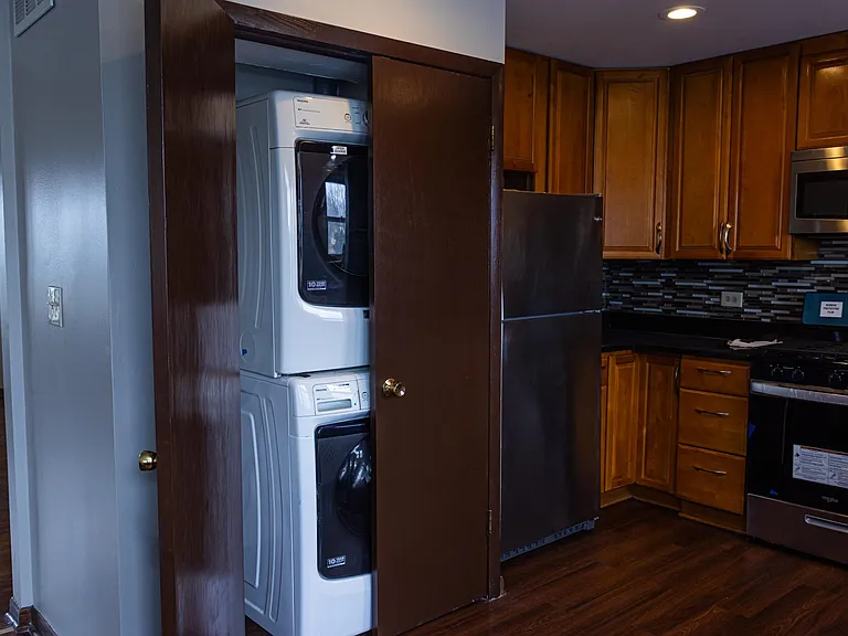 laundry nook and part of the kitchen - stainless steel chef's stove
