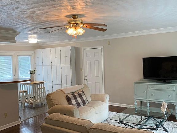 Living Room with doors to deck and garage