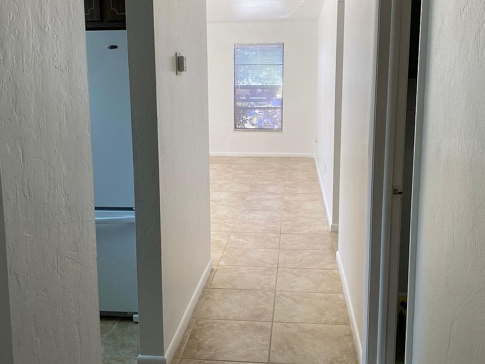 All tile floors and fresh paint throughout make this a clean and bright home.