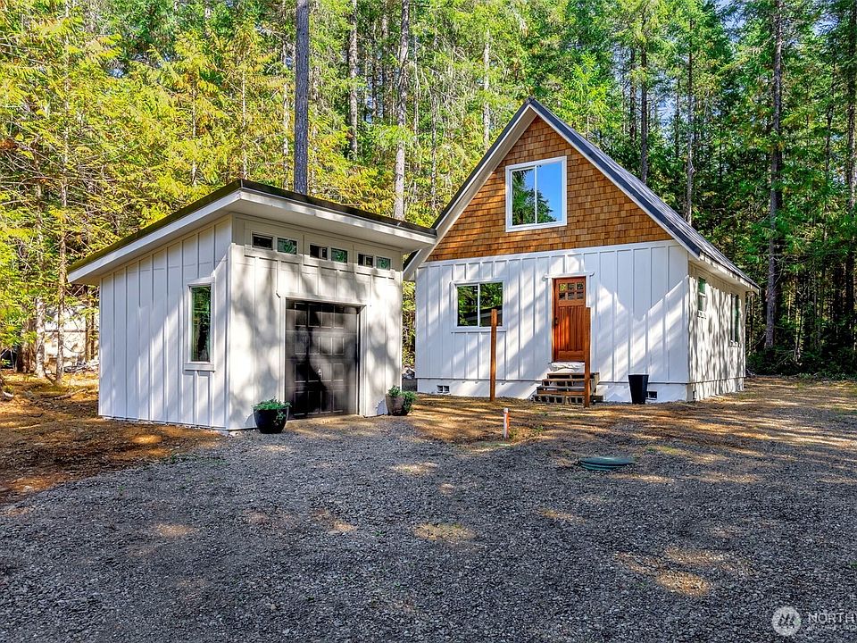 All the hard work is done...This beauty is ready for the final finishes! Beautiful lot with circular drive, sunny interior and tree's left around the perimeter for privacy. Home is framed with windows, doors, and roof.  24' x 24' footprint with 576 SQ FT on the main floor and 288 SQ FT loft. Owner will transfer the permit to your name and you can choose all the finishing touches! Located in Lake Cushman Div# 5 in Hoodsport.  99 year lease expires Apr 2065.>