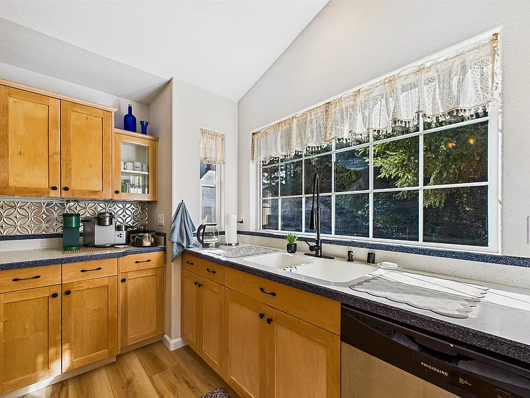 +Appliances new as of 2025
+Coffee bar
+Dishwasher
+Fridge/Freezer, Cook top (4)(electric), Microwave, Oven
+Garbage Disposal
+Seating for 3 at the bar