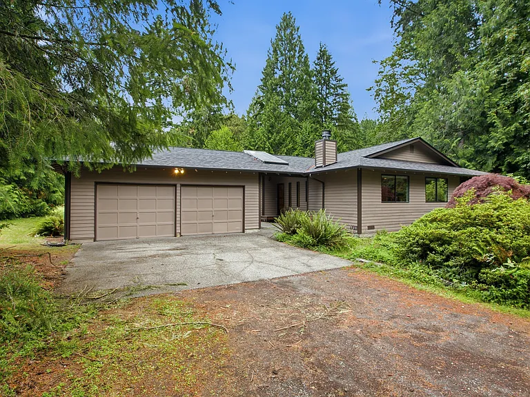 Two car garage with covered atrium to the front door