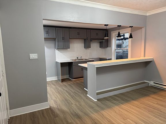 Modern open kitchen with bar seating, ideal for entertaining.