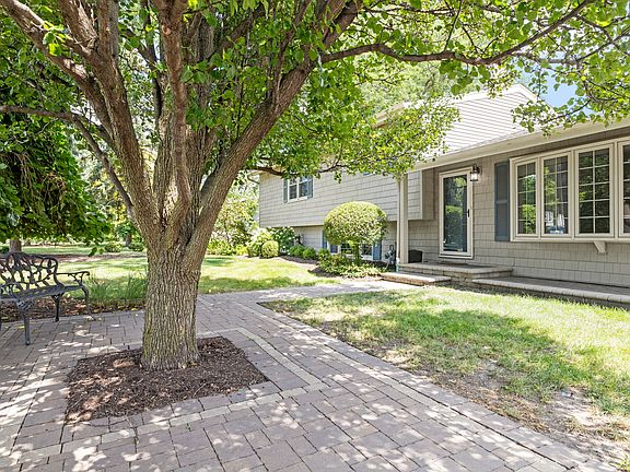 Front of Home with Bay Window, paver patio with sitting area