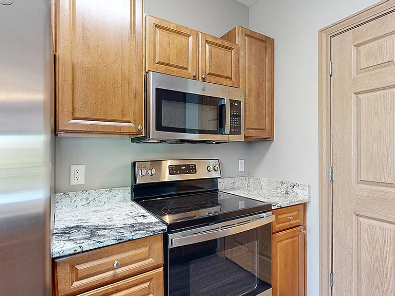 Renovations feature stainless steel appliances and granite counter tops.