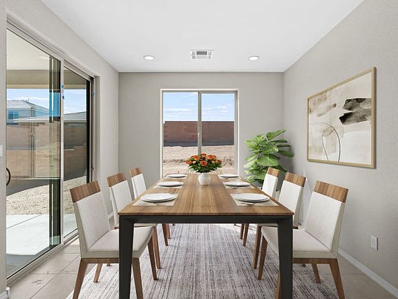 Sunlit cafe off the kitchen is the ideal space for family dinners or busy mornings.