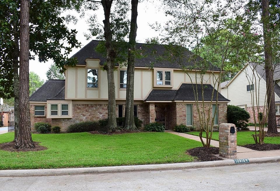 IMPROVED & UPDATED CLASSIC LAKEWOOD FOREST. Rare game room design with fireplace, cathedral ceiling with dropped beams. You get the feeling of being at a lodge retreat. Notice also the rare 3 car garage that is not on a corner lot and the gate across