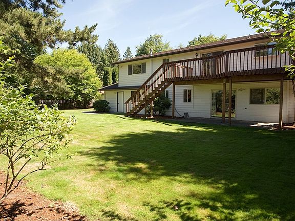 Standing beneath the fruit trees and looking east toward the home.