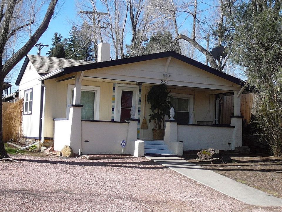 Front of Home w/ Covered Porch & Swing