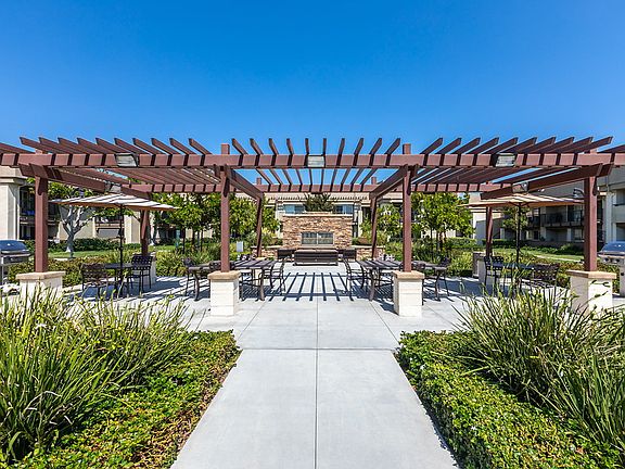 Picnic and BBQ area with tables and chairs.