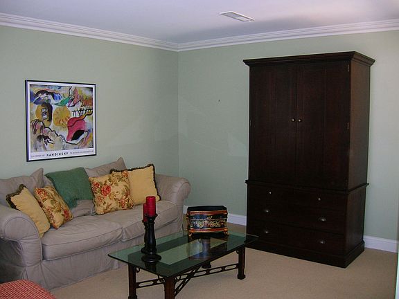 Other family room view with wall to wall carpet.