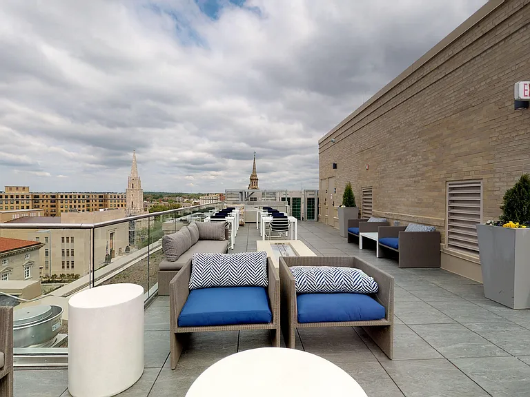 Rooftop lounge with fire pit and grilling stations