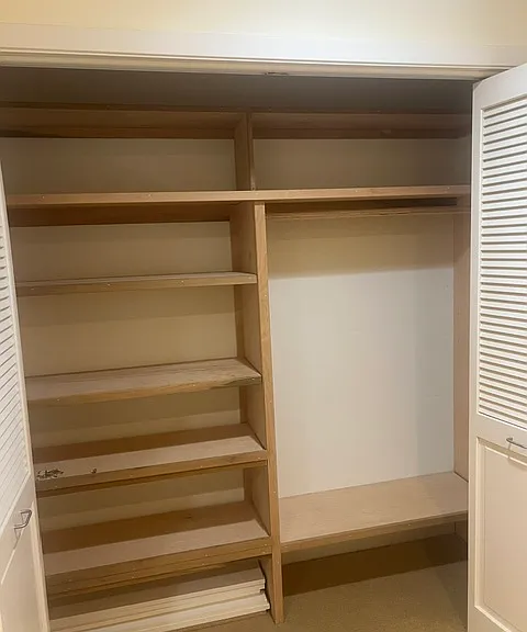 Bed room 1, folding doors with shelving.