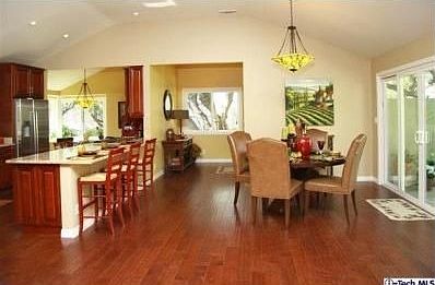 What a wonderful GREAT ROOM floor plan - this view is looking toward the dining area and kitchen.  Behind the photographer is the "living room / family room" area.