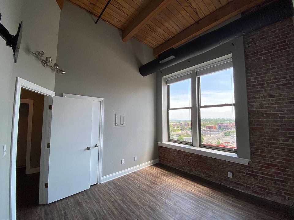 Bedroom is approx 12x12 ft with opening windows and expansive city views